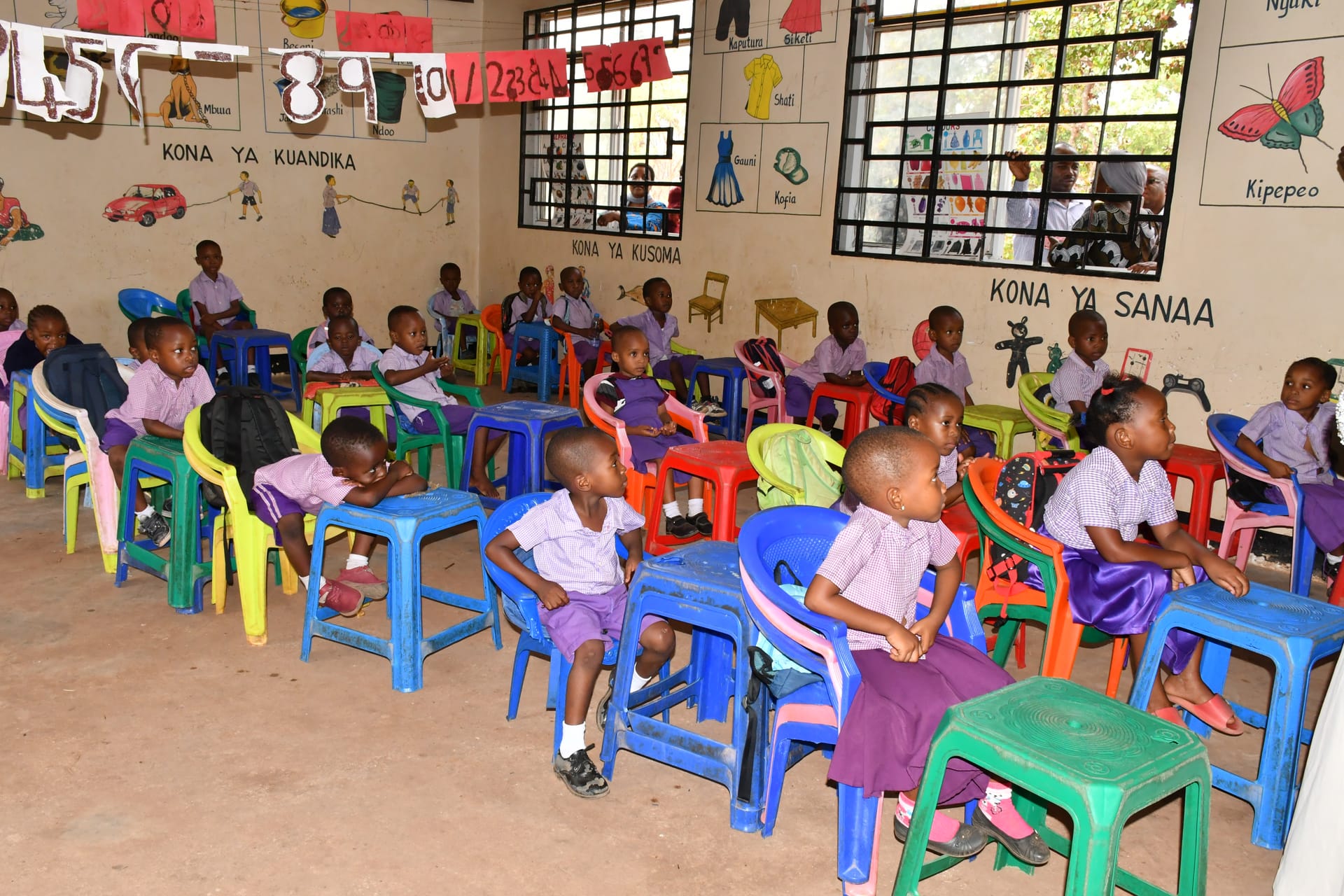 Children in an ECD classroom with Swahili learning corners