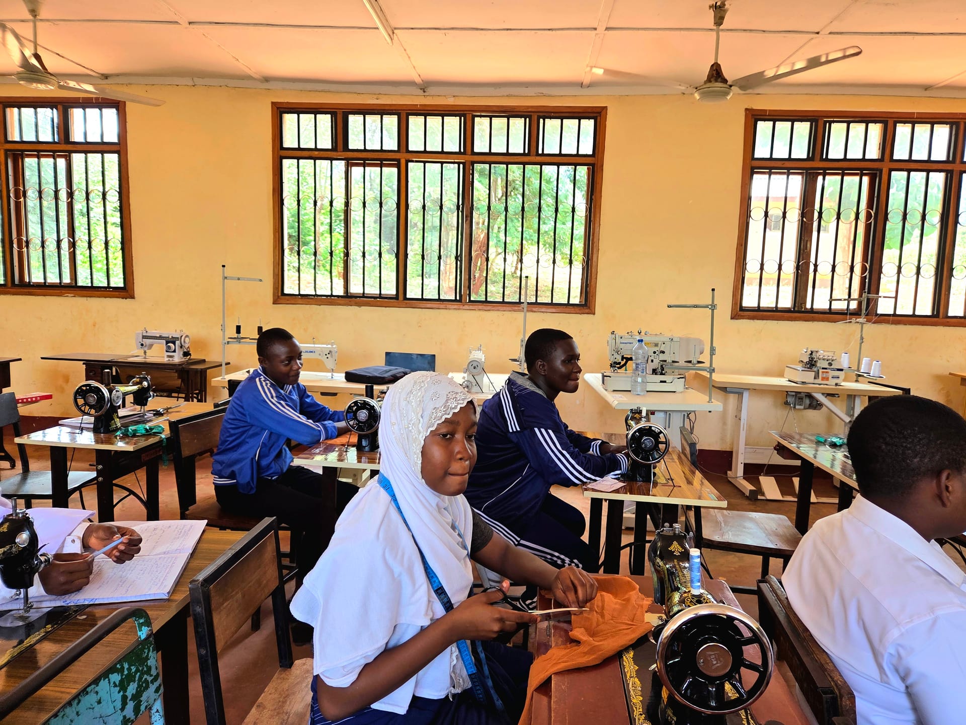 Young women in a classroom session at an FDC